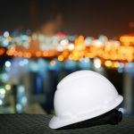 safety hard hat and lights in background